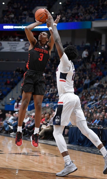 No. 9 Houston beats UConn 71-63 for 9th straight victory.